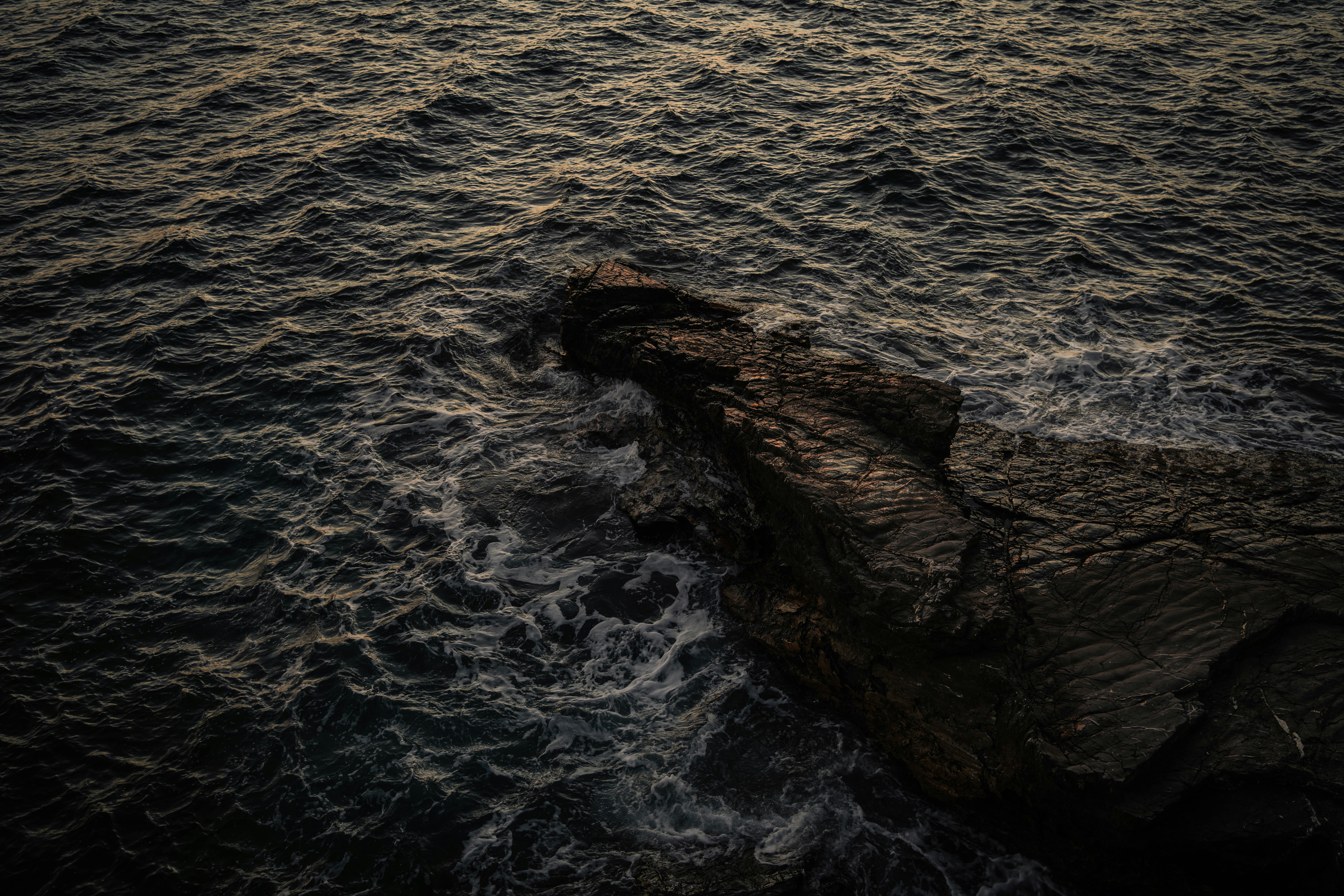Rocky Ligurian coastline at dusk in Nervi, Genoa